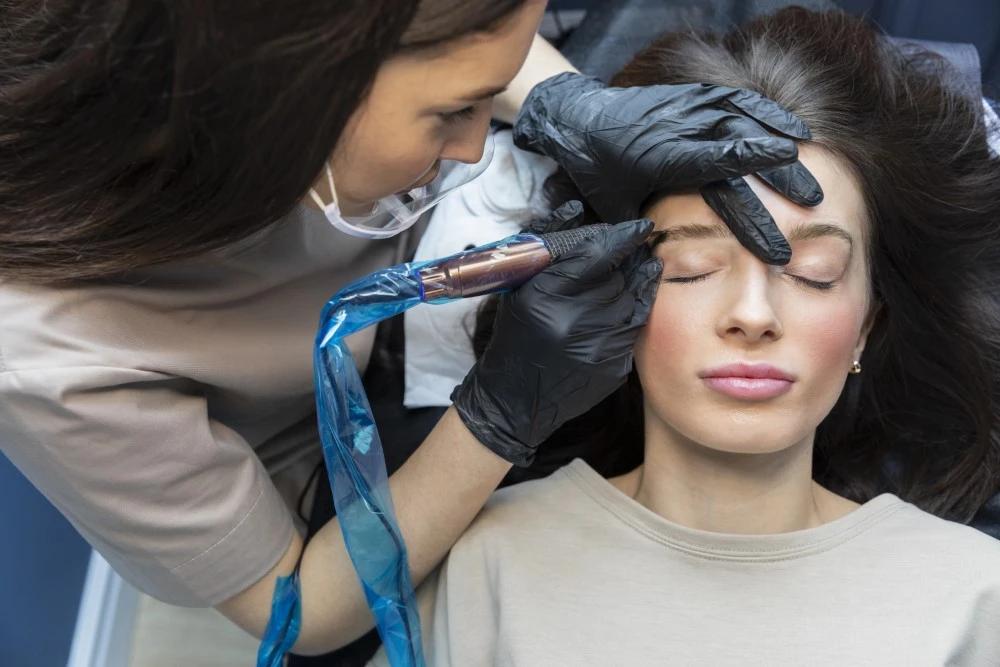 beautician-doing-eyebrow-treatment-her-client