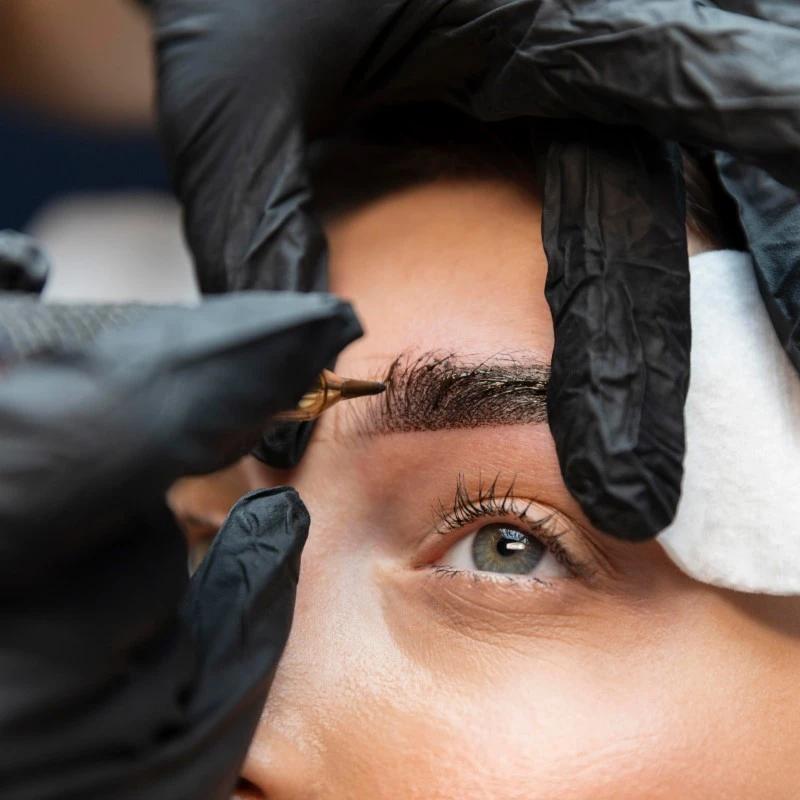 young-woman-getting-beauty-treatment-her-eyebrows